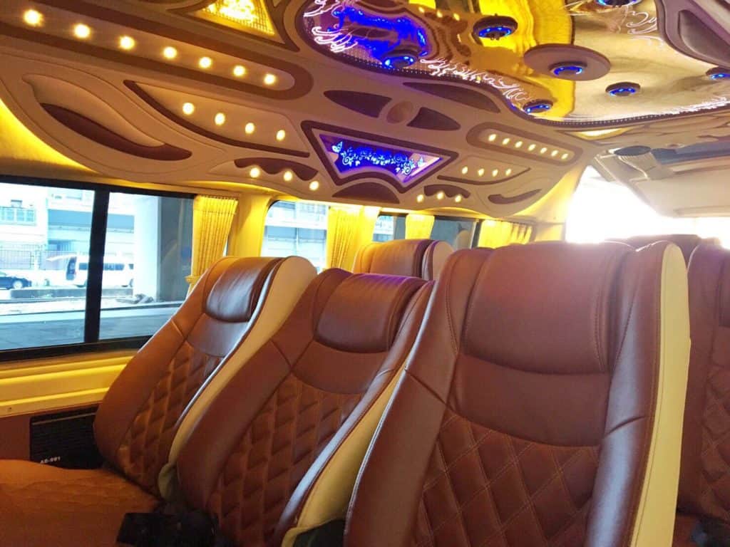 The inside of a 12Go Vip Van